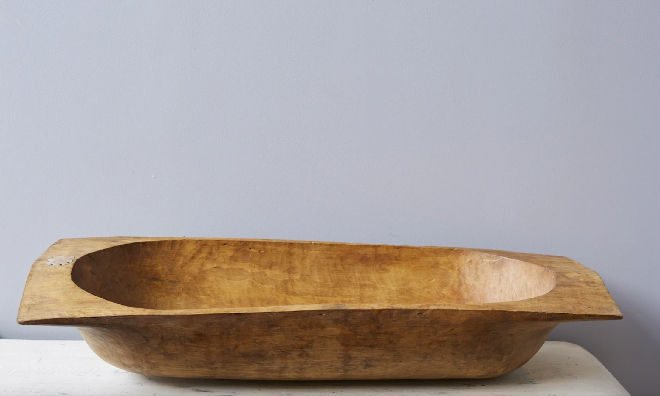 Antique Oval Dough Bowl with grey wall