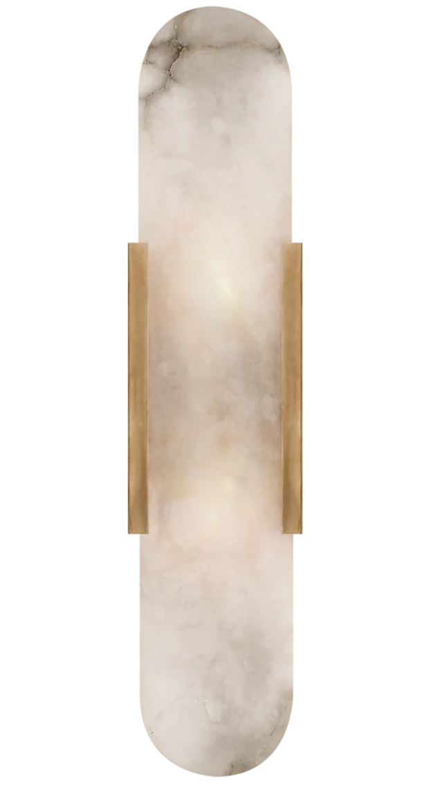 Add Warmth to Any Room: Melange Elongated Sconce in Aged Brass